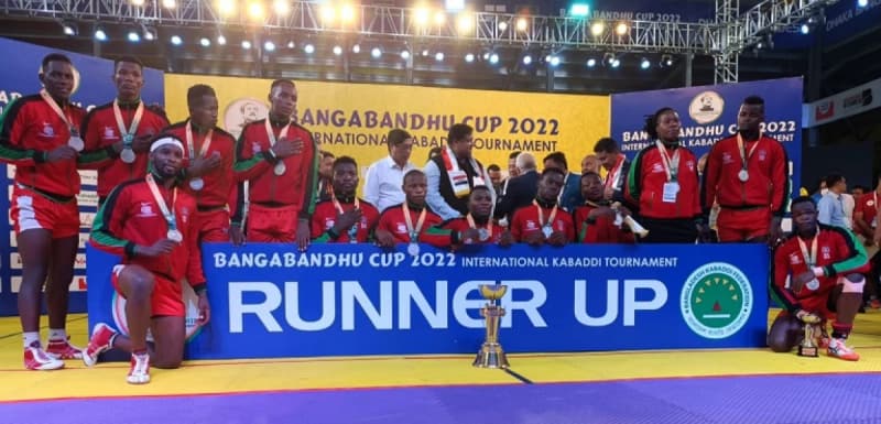 Kenya’s squad with the runners-up banner at an earlier Bangabandhu Cup.